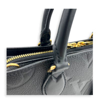 OnTheGo East West Black Top Handle Bag in Empreinte Leather, Gold hardware