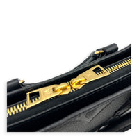 OnTheGo East West Black Top Handle Bag in Empreinte Leather, Gold hardware